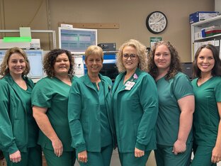 Laboratory Staff smiling. There is six females.
